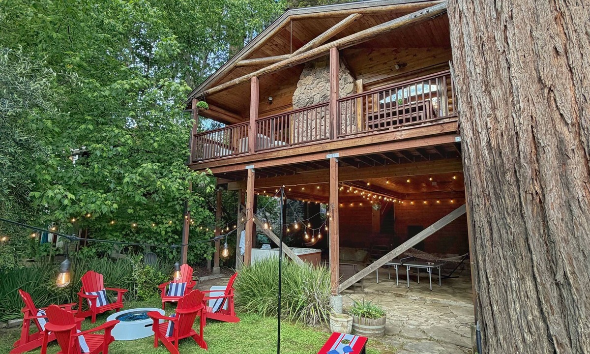 Northwood Cabin | Riverfront cabin, hot tub, private dock, redwoods, ping-pong, foosball