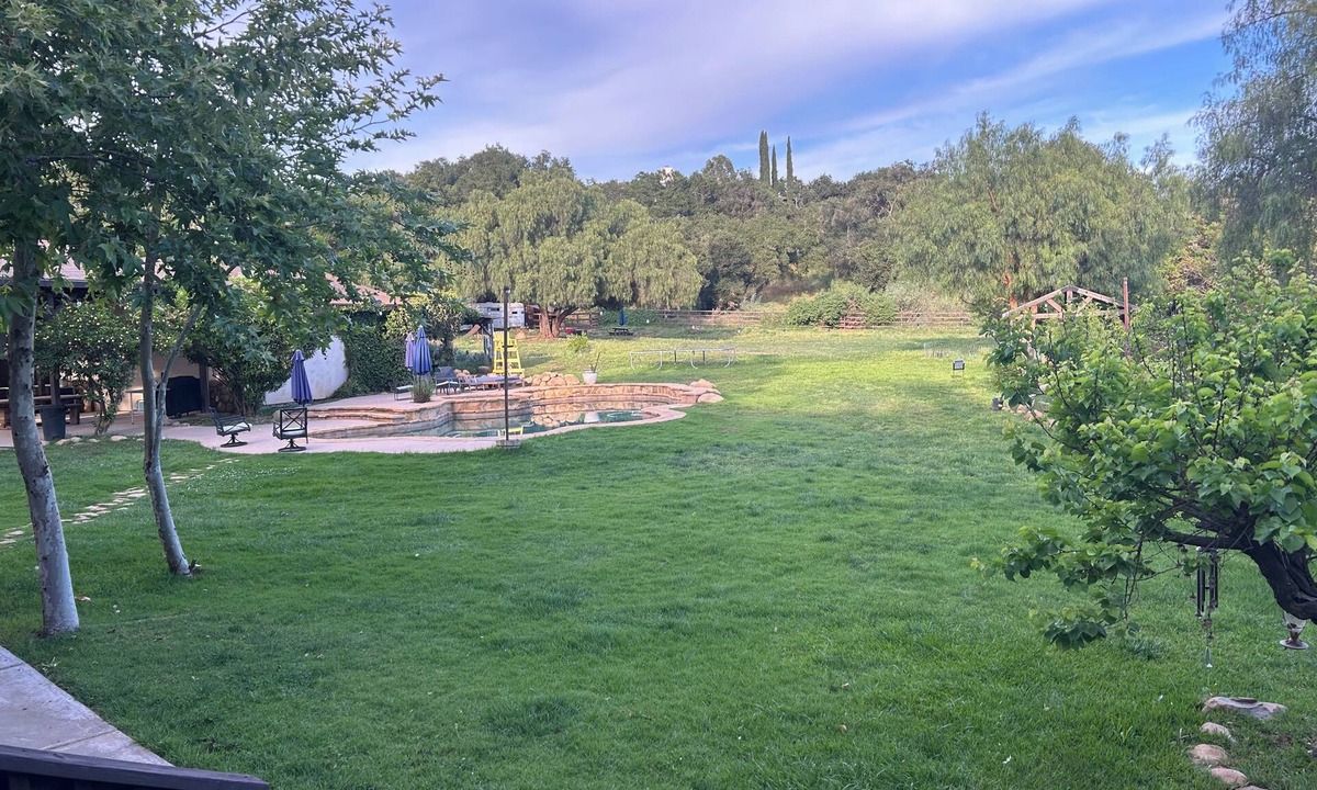 Mira Monte House | Winnebago camper set up on beautiful property with resort style pool and jacuzzi