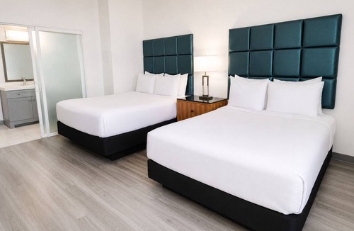 Little Italy Hotel | Enjoy Scenic Harbor Views from Bright Room in Little Italy’s Artistic Hub