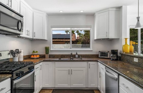 Desert Park Estates House | Palm Paradise offers a private 3BR retreat with a saltwater pool, fire pit, BBQ, and mountain views. Just minutes from downtown, this stylish getaway is perfect for families or friends seeking relaxation and Palm Springs charm.