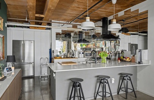 Arts District Condo | Sun-drenched, chef's kitchen, and beautifully collected, Arts District loft