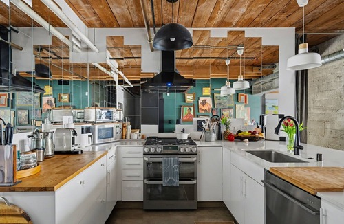 Arts District Condo | Sun-drenched, chef's kitchen, and beautifully collected, Arts District loft