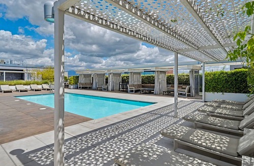 Arts District Condo | Sun-drenched, chef's kitchen, and beautifully collected, Arts District loft