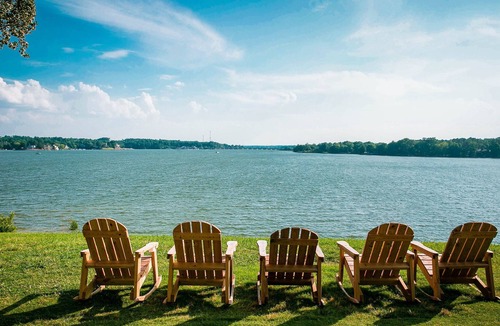 Steele Creek Cabin | Waterfront, 100- Year-Old wood Cabin #16 at Long Cove Resort by RedAwning