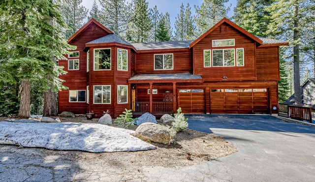 Inviting spacious home with fireplace, deck, hot tub, full kitchen, & W&D