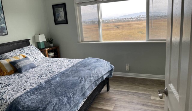 Third story condo with tiny beach view. Across from ocean and on estuary.